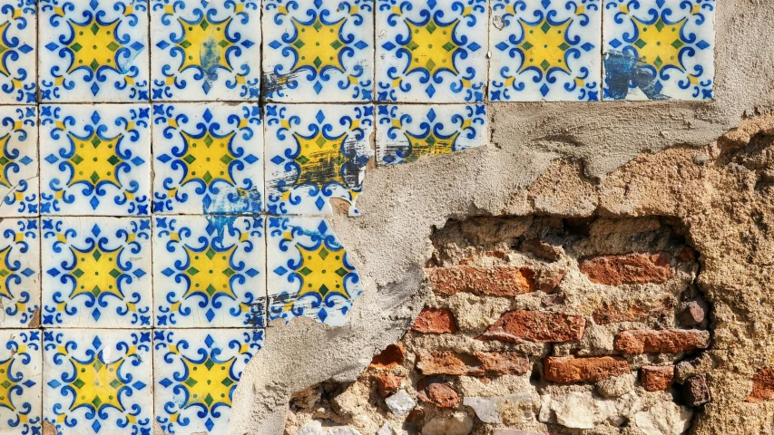 a blue and yellow tile design in an old village