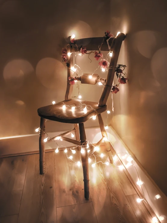 a chair with fairy lights dd on it