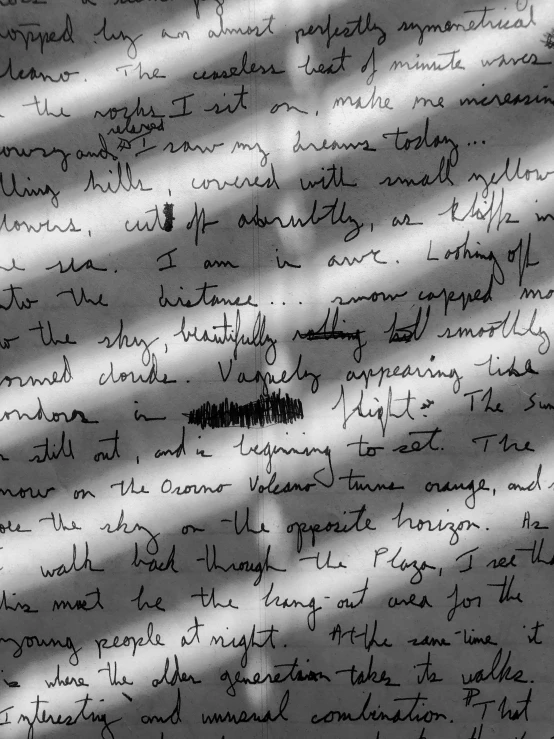 the shadow of a wall on a wall with writing on it