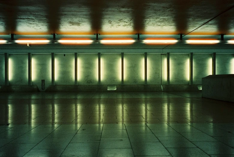 an empty airport with tile floor and lighting