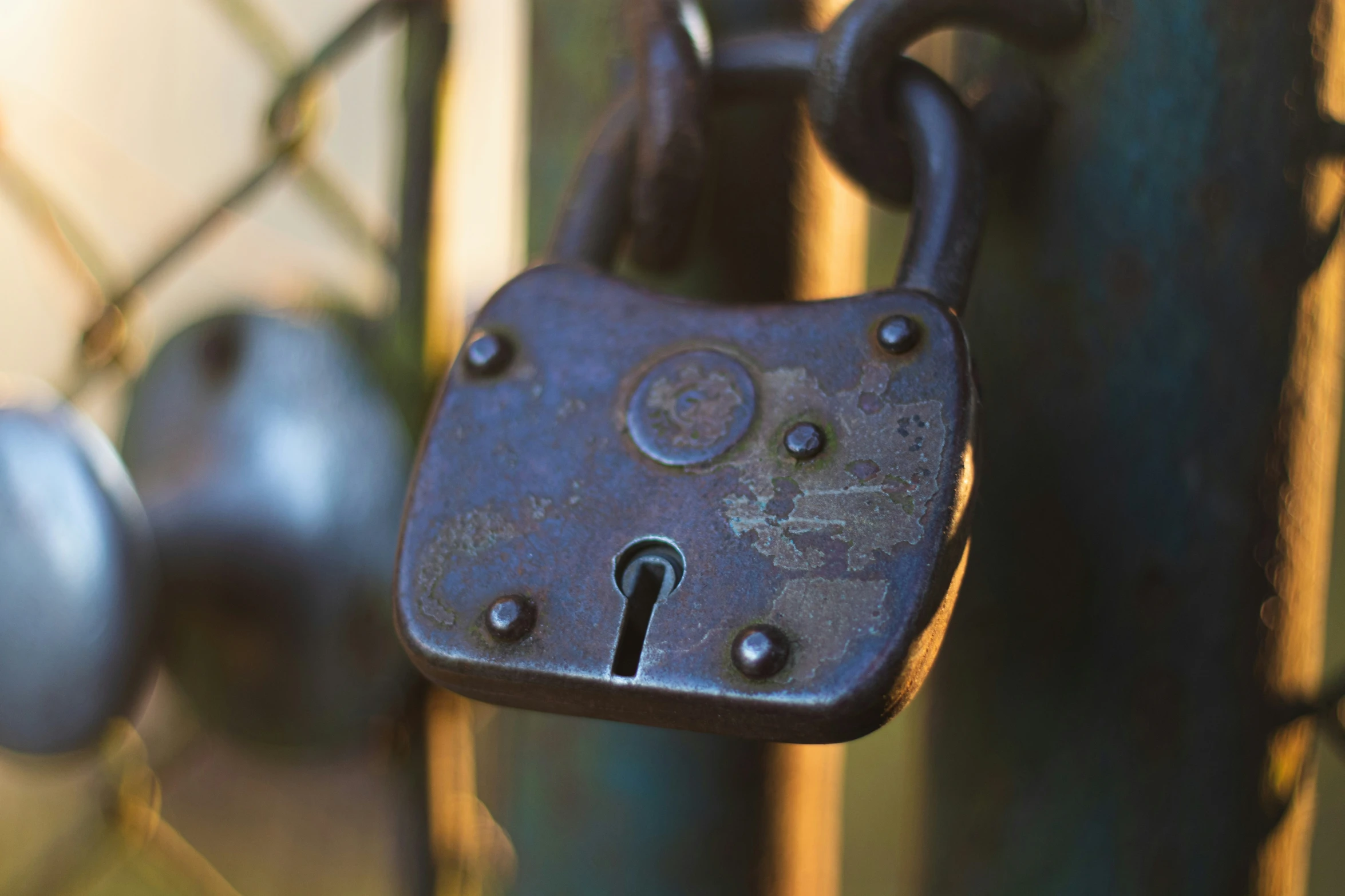 an old lock with a key on a chain