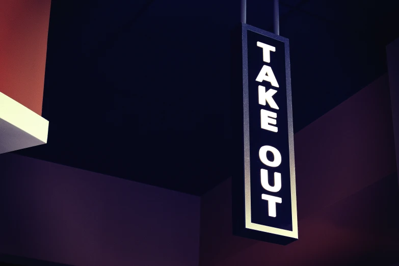the signs on the pole say take out