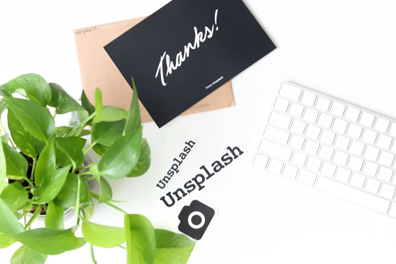 a black sign sitting on top of a white desk