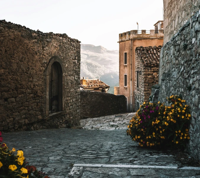 an alley way leading to two old buildings