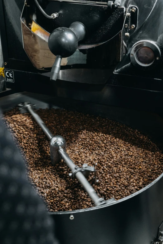 the beans are being pressed through a machine