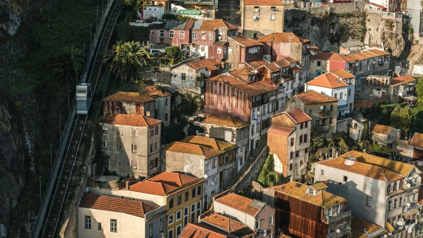 aerial view of a red roofed city on hillside