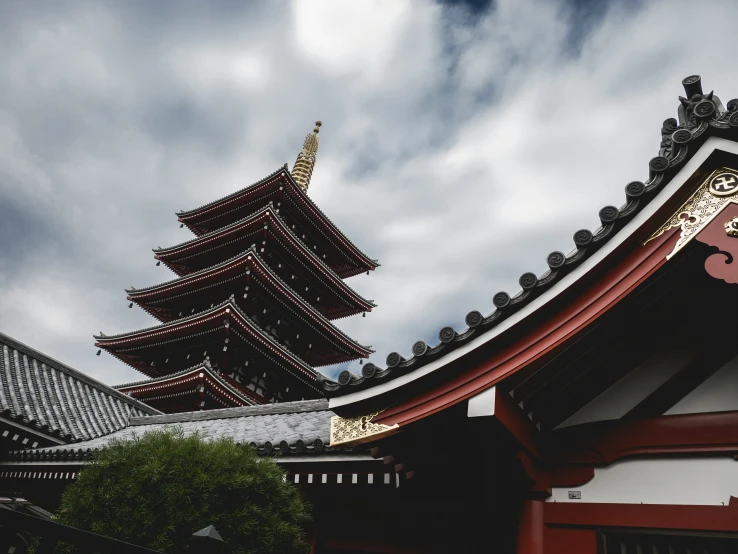 a very tall tower next to some buildings