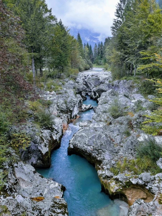 the river is blue in the mountain stream