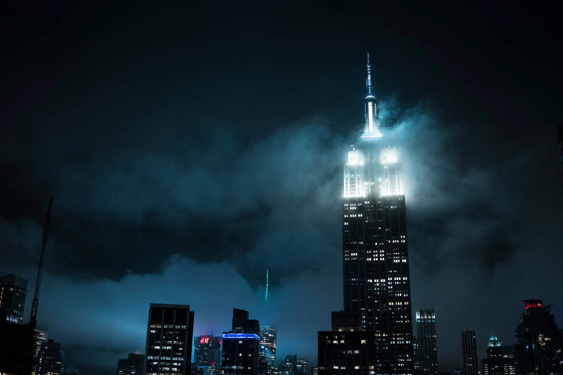 the new york city lights as seen from a high rise building