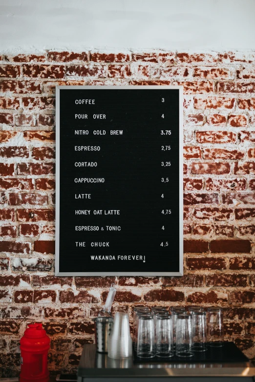 the menu board has several drinks on it