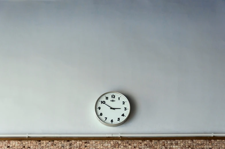 a clock mounted to the side of a wall