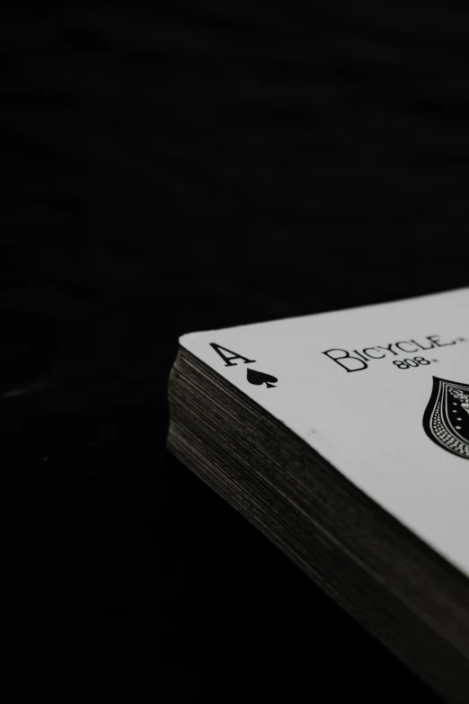 a close up of a playing card with the number four in it