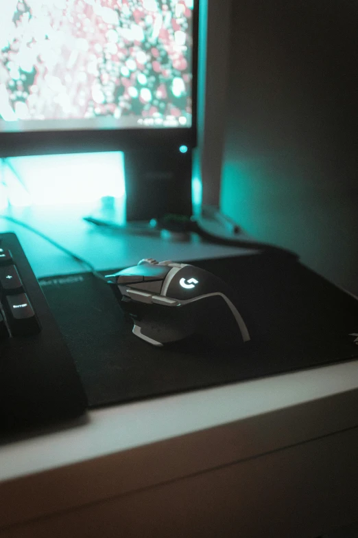 a laptop computer sits in front of a computer monitor