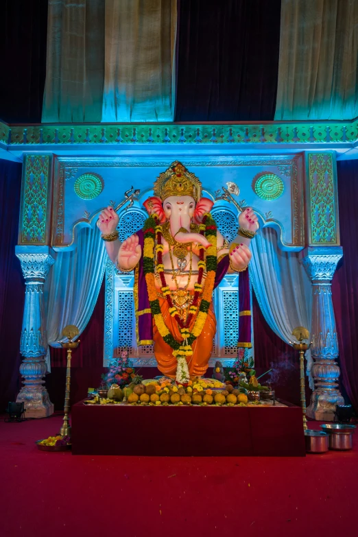 the idol of ganesh on display in a large room