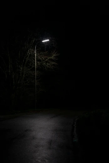 street lamp in the dark at night with no light shining