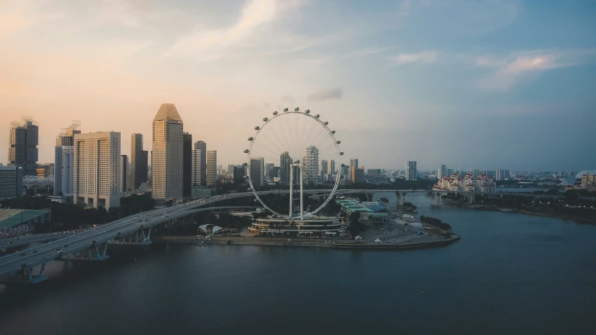 the city skyline is shown in front of the ferris wheel