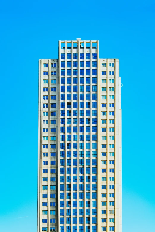 two people sitting on bench in front of an empty building