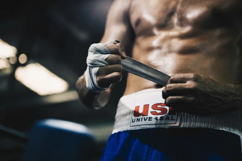 a closeup of a man holding a pair of scissors