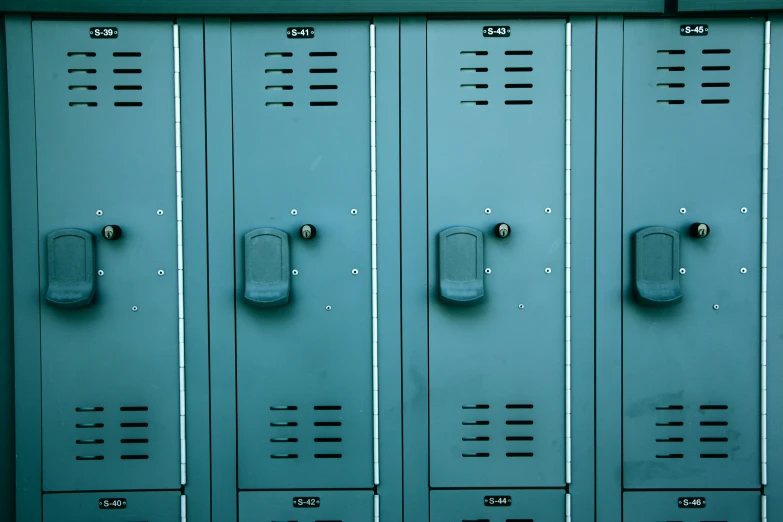 two rows of lockers with doors and a clock