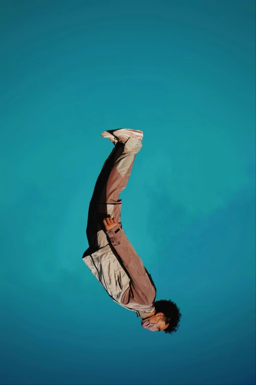 a man floating in the air while upside down