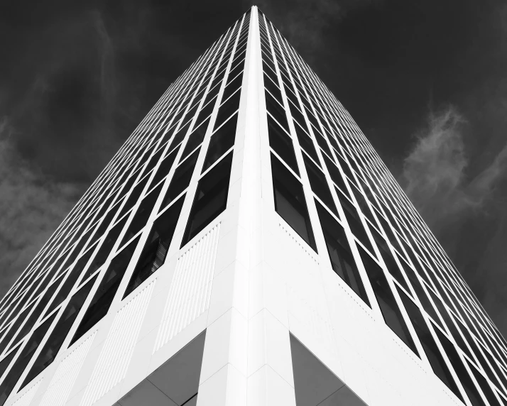 a tall building with lines of white painted in the side of it