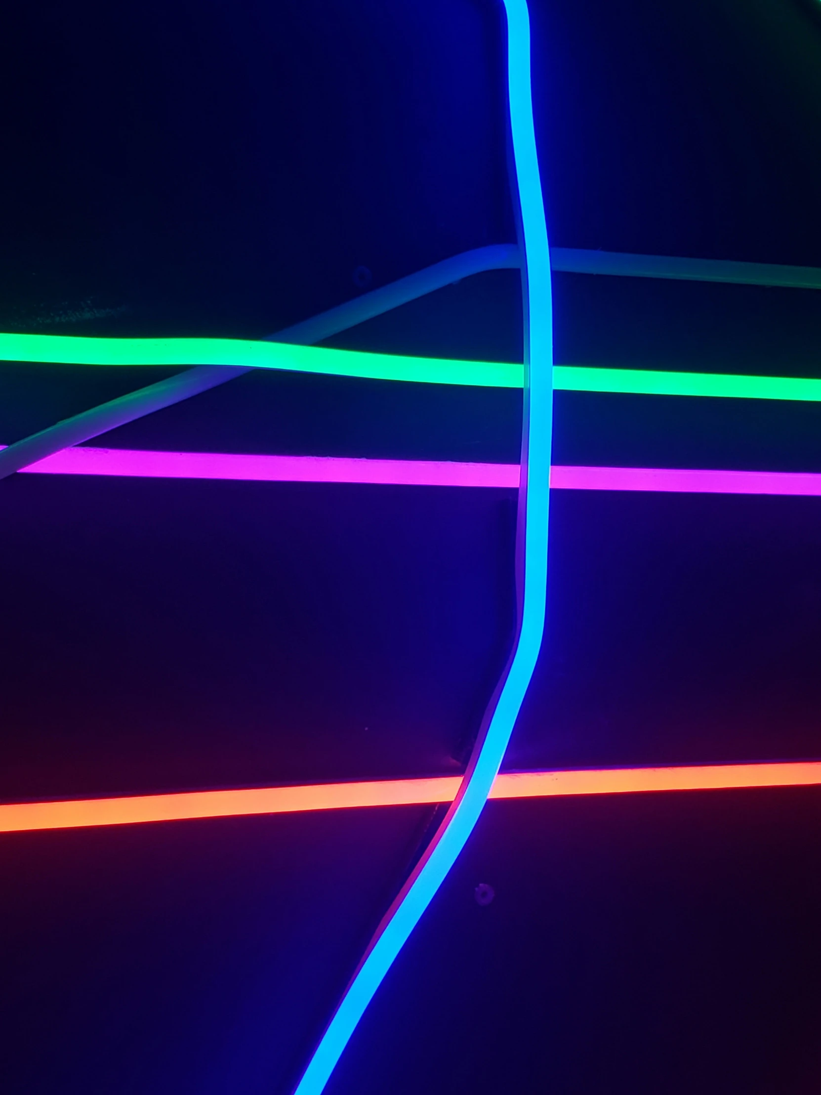 blue neon lines are glowing against a black background