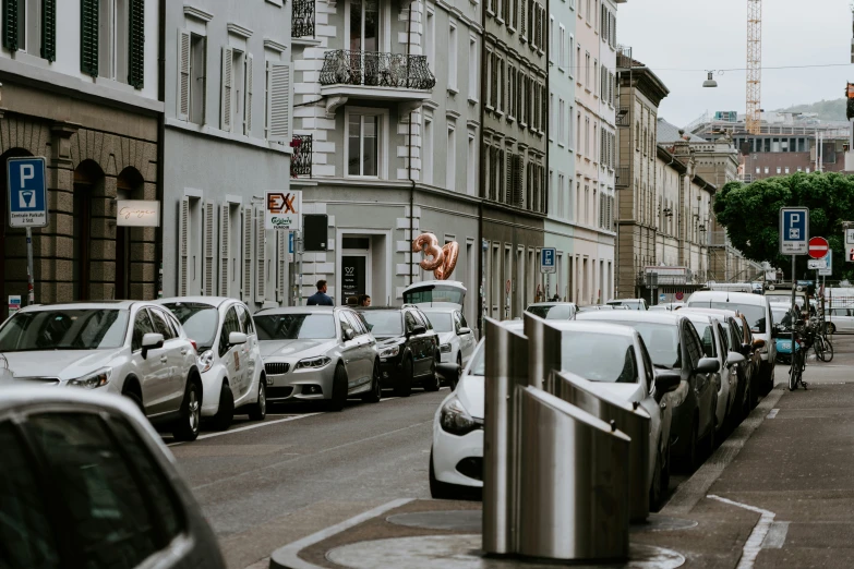 a city street lined with lots of cars