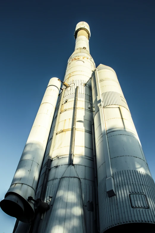 the front of the tower is looking up at a sky