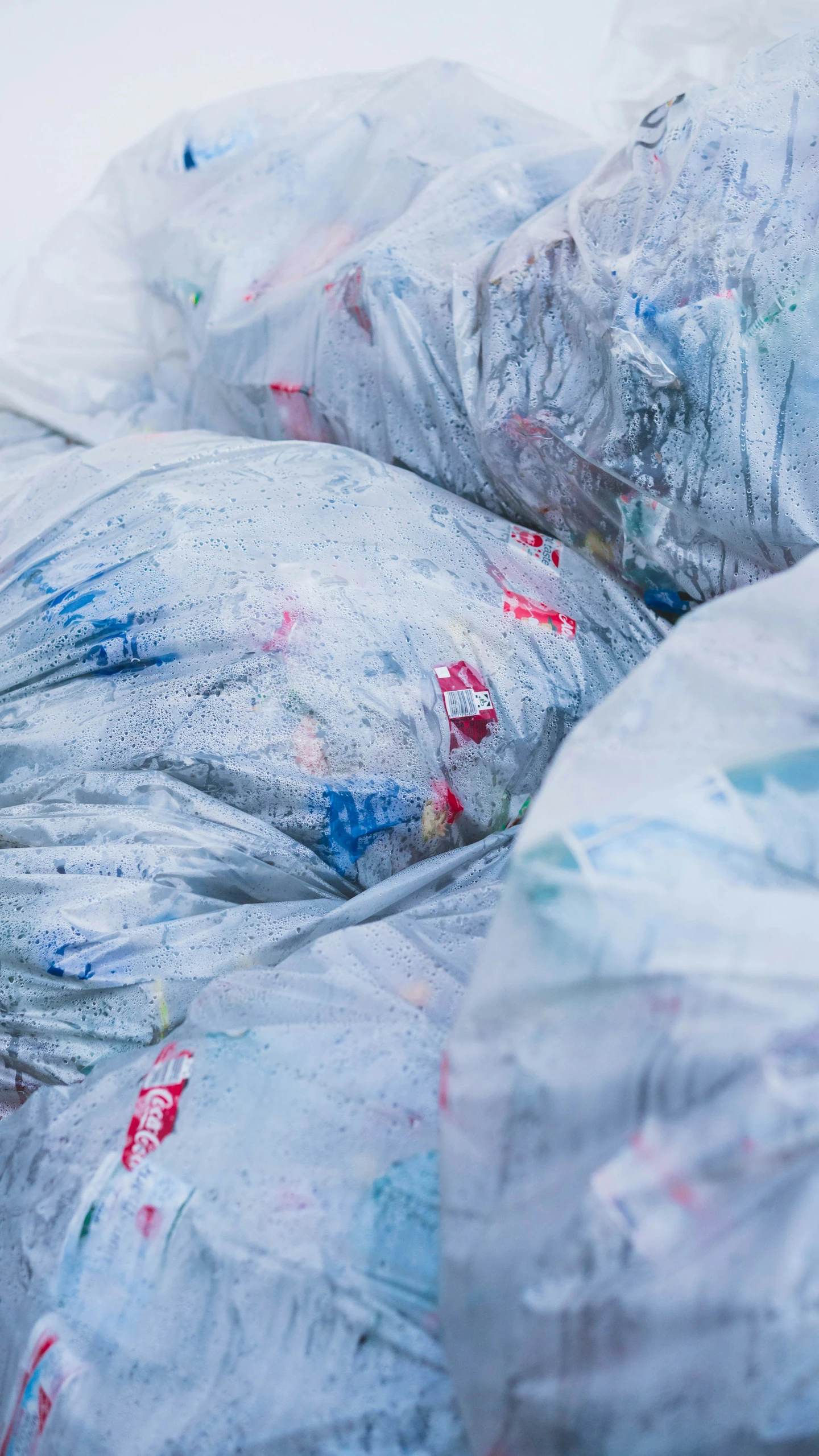 there are bags full of plastic trash on the street