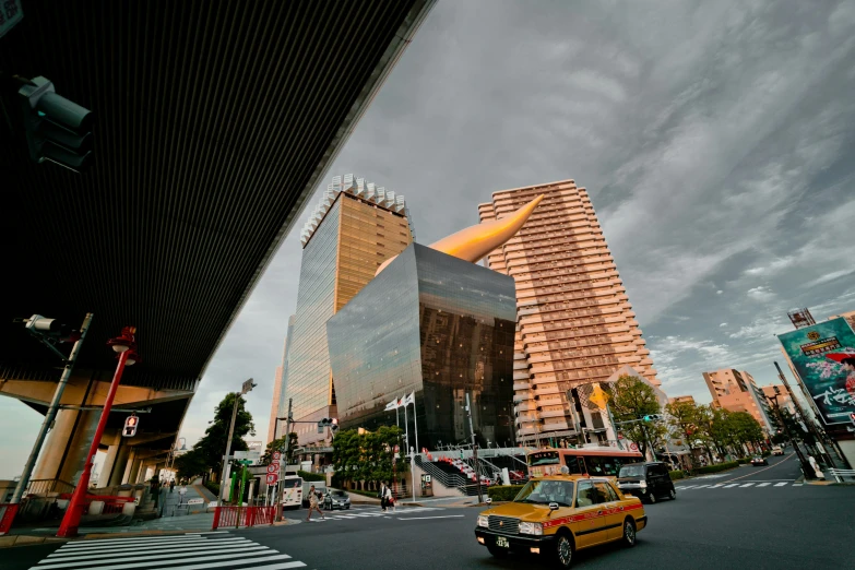 the city street with a taxi driving on it