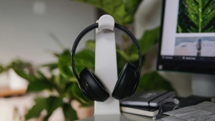 headphones are sitting on top of a desk
