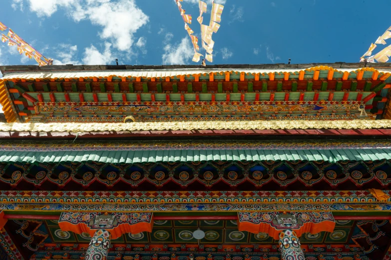 a close up of a tall colorful building with an elaborate pattern