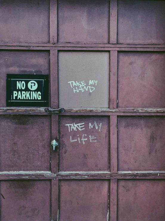 the sign is attached to the brick wall