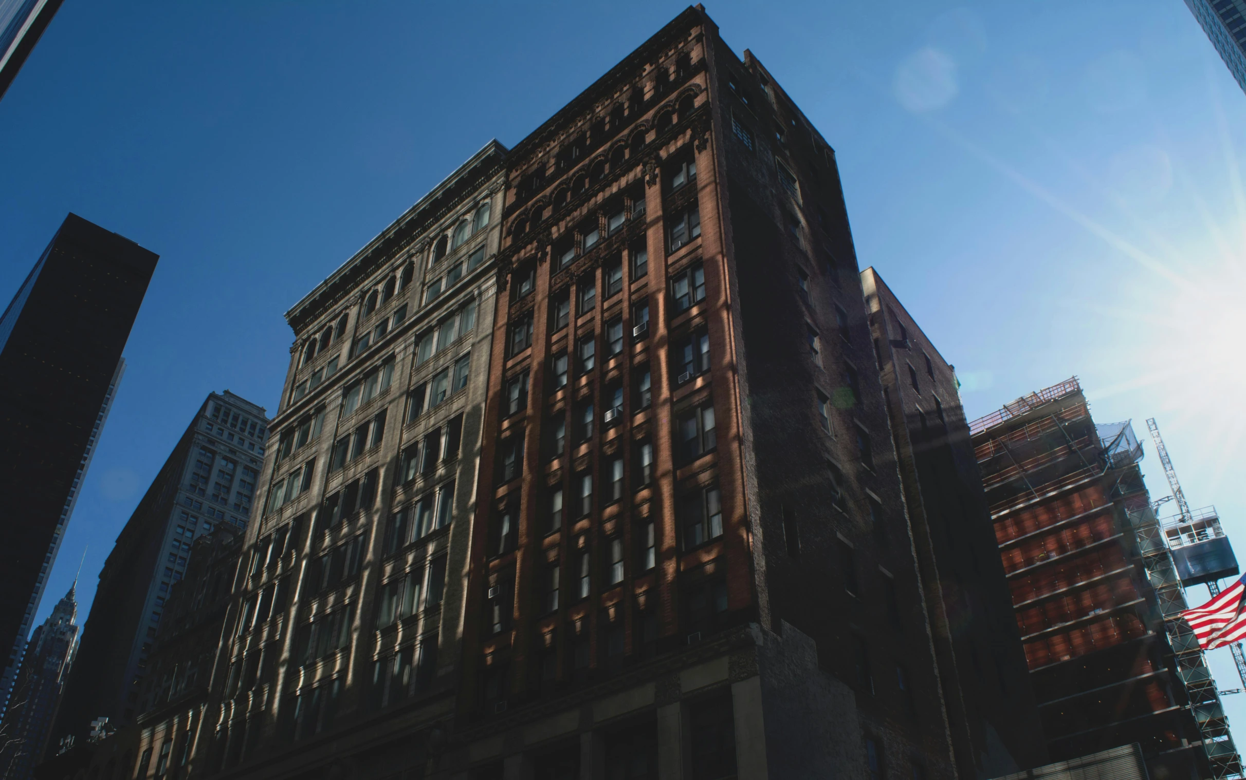 a picture of a very tall building on the street