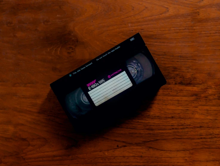 an old video tape player sitting on a table