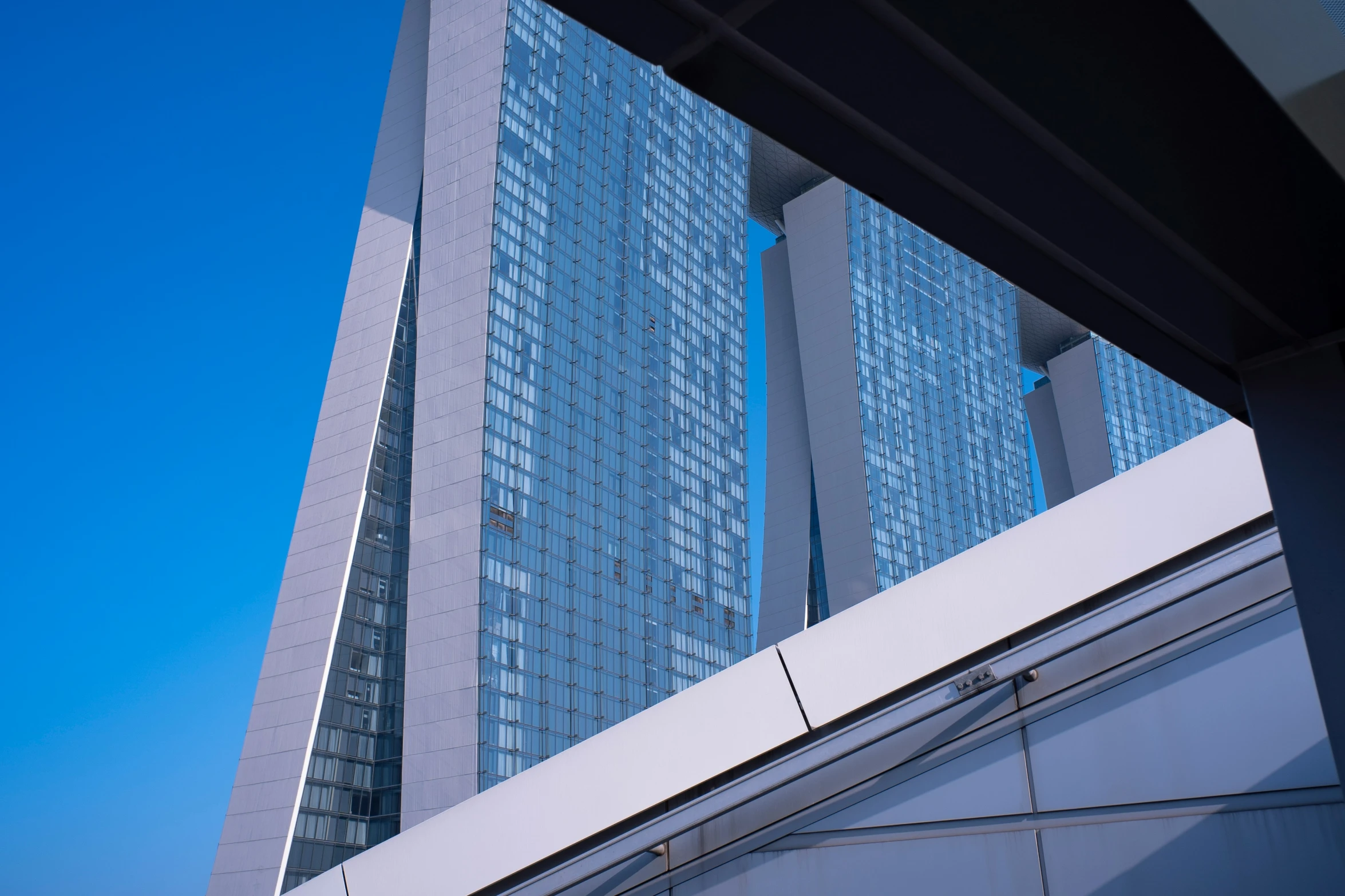 a very tall building with many windows in the front