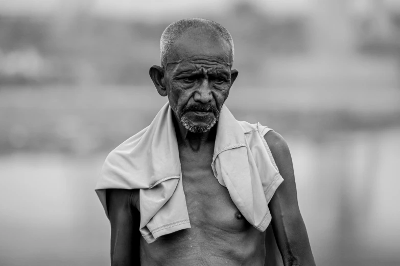 a man is wearing a towel on his back