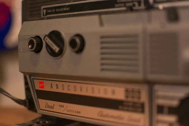 a radio receiver sits on top of a desk