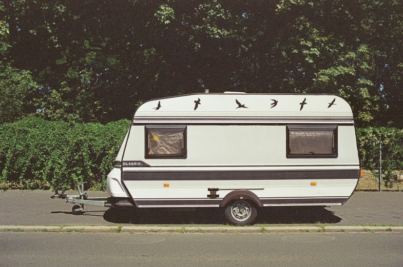 a trailer is parked on a road side