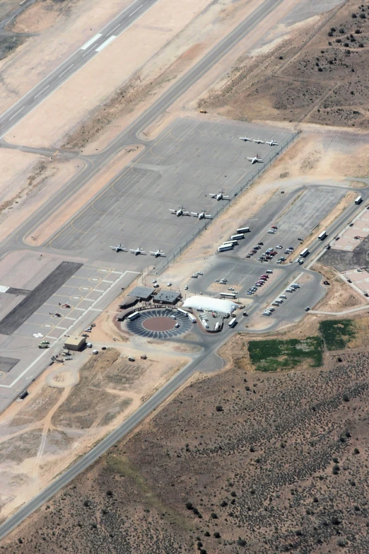 an aerial view of a runway with various planes on it