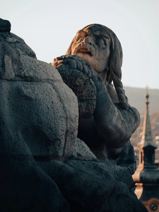 an image of a statue on top of a building