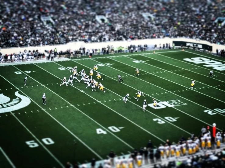 some football players on a field and fans