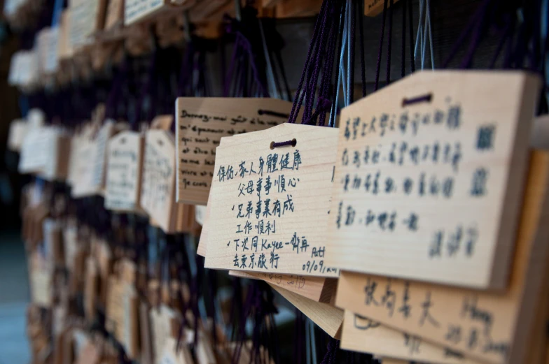 many plaques that are hanging up on a wall