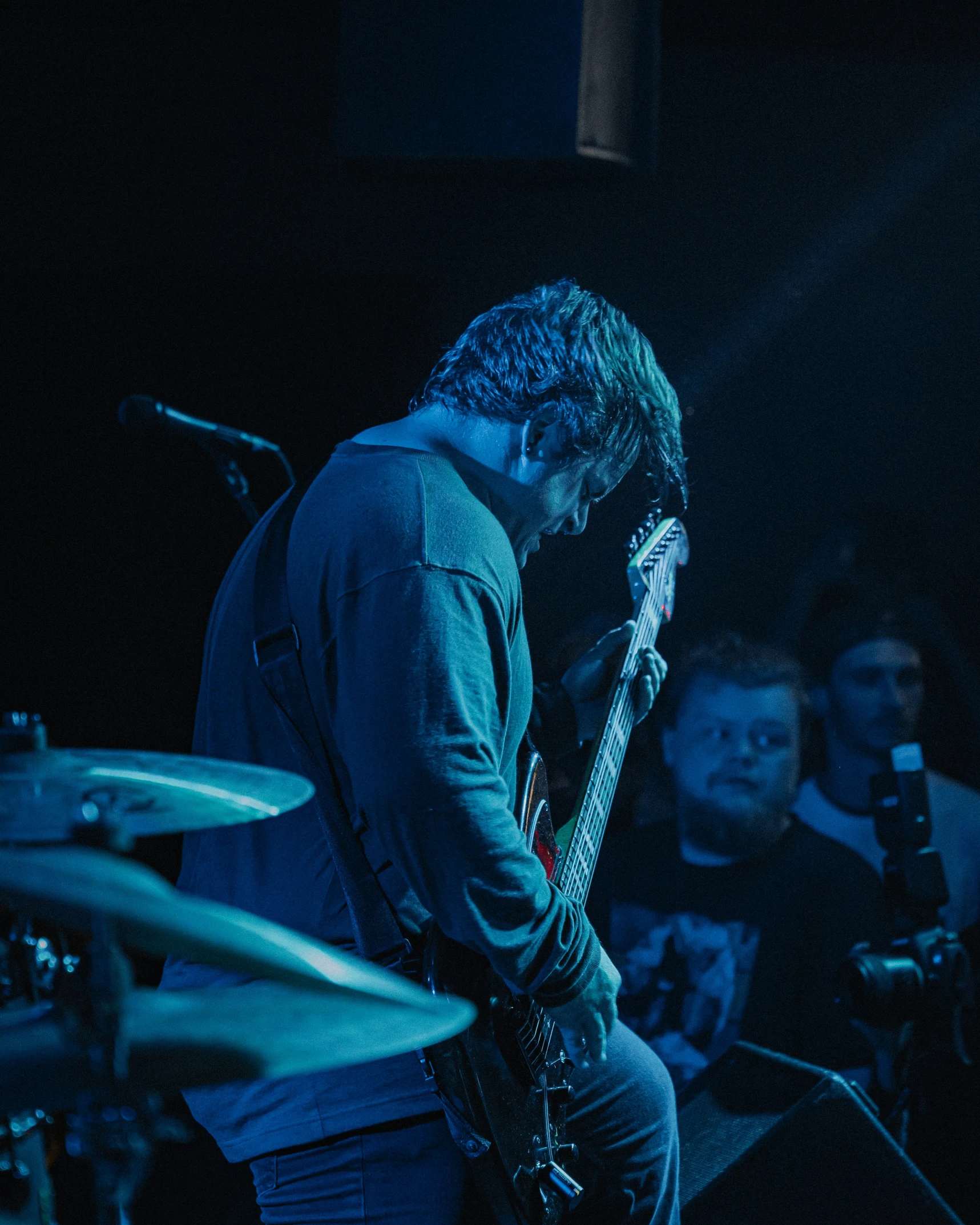 an image of a man playing bass guitar