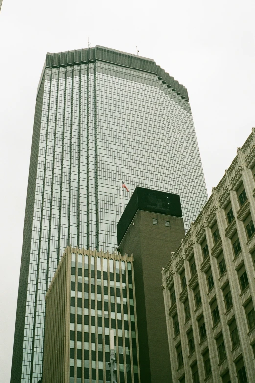 two very tall buildings against the sky