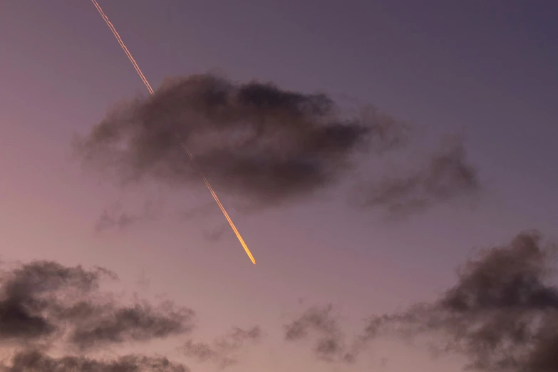 an airplane is flying in the night sky