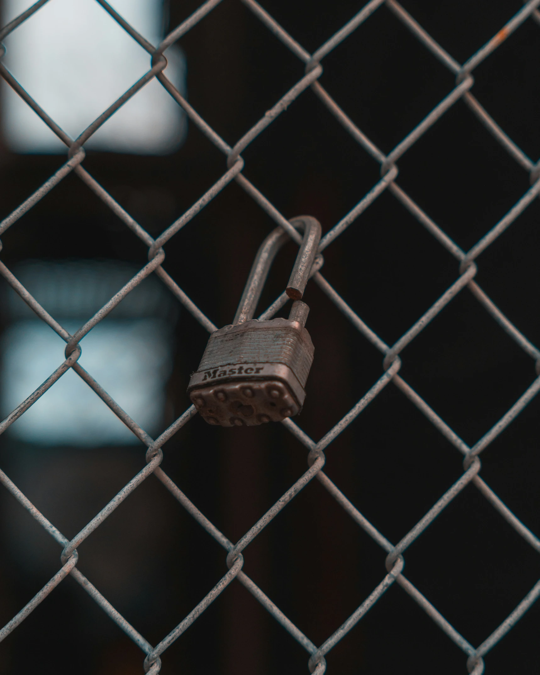 the key is locked on the chain link fence