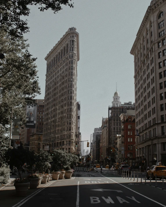 two city buildings and one large city building are in the foreground, while another is in the background