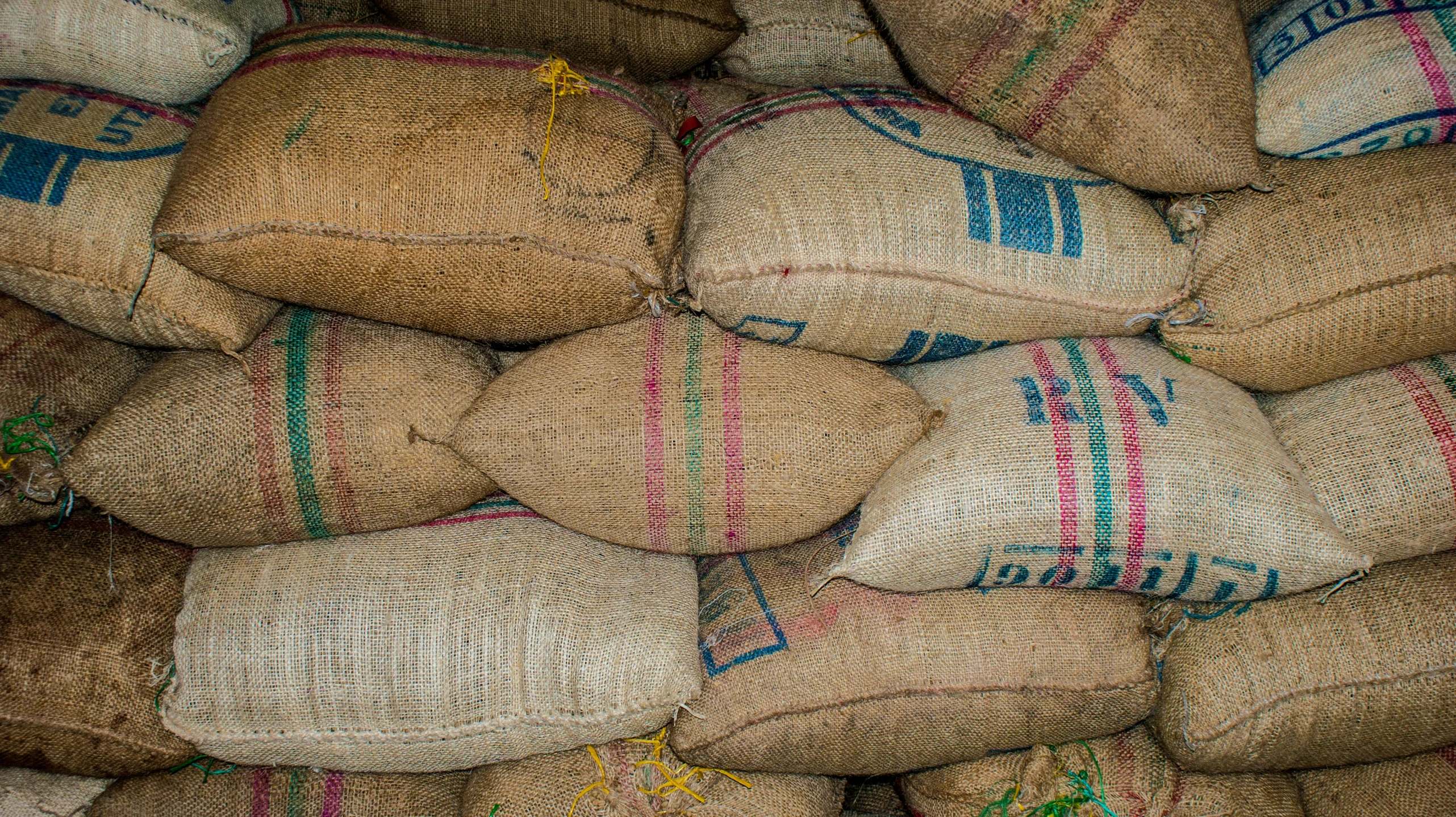 sacks and bags are stacked on top of each other