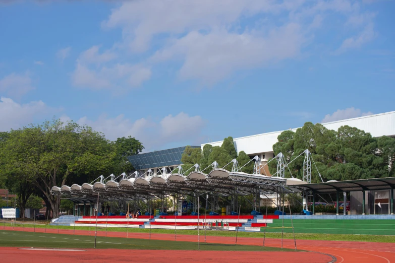 a baseball stadium with seats sitting on it's grass